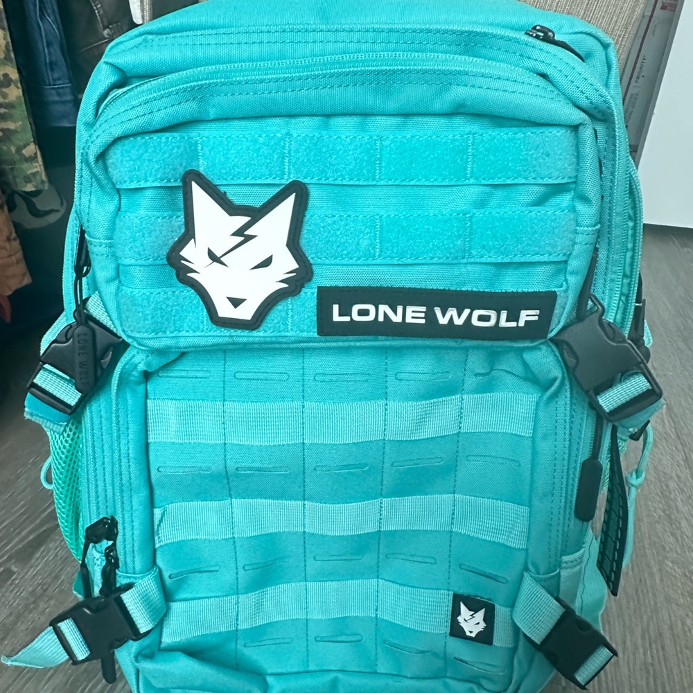 Lone wolf tactical backpack. Like new, teal color